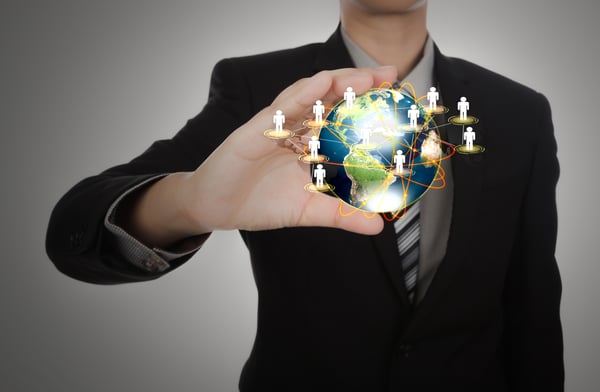 businessman-holding-planet-earth-with-people-symbols