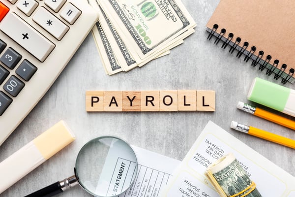 top-view-payroll-concept-with-items